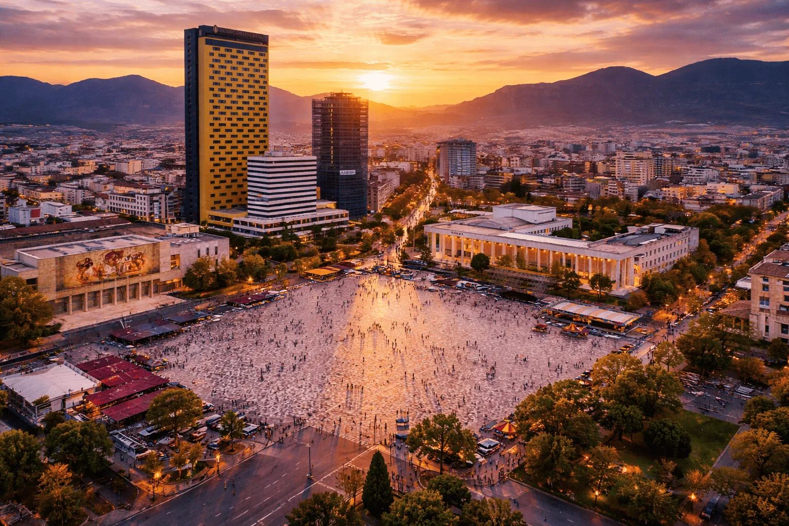 Skanderbeg Square in Tirana at sunset, with the mountains beyond